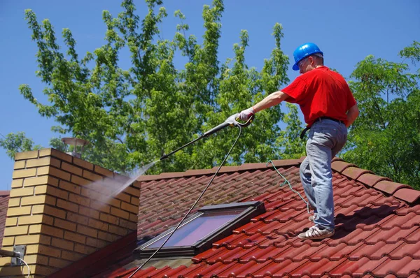 depositphotos_279100964-stock-photo-house-roof-cleaning-with-pressure